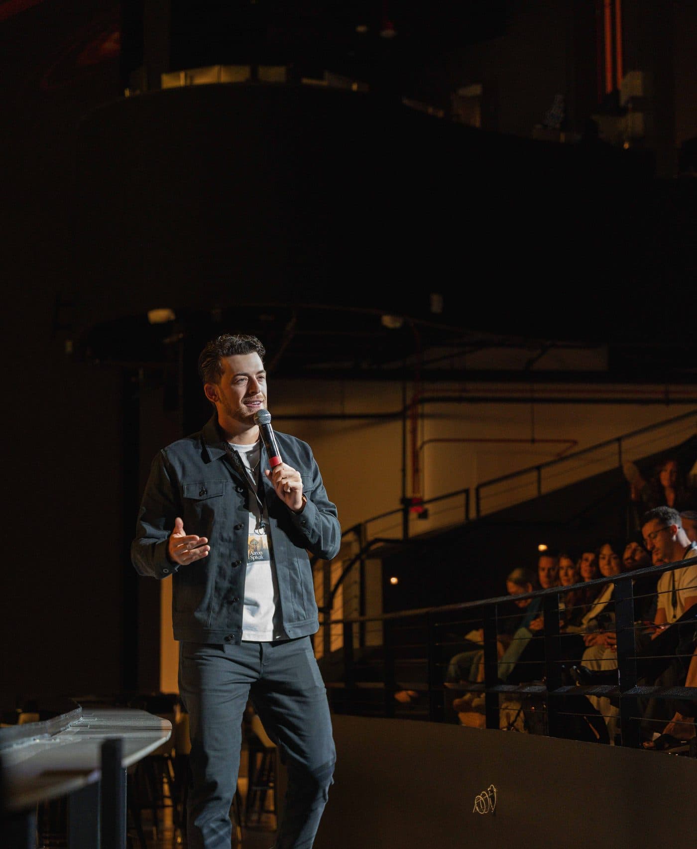 Aaron Spivak speaking on stage