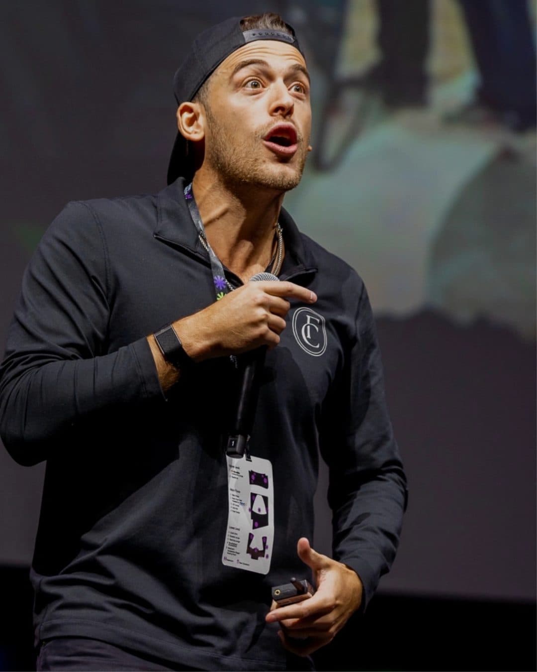 Aaron Spivak on stage at a Founders Club event